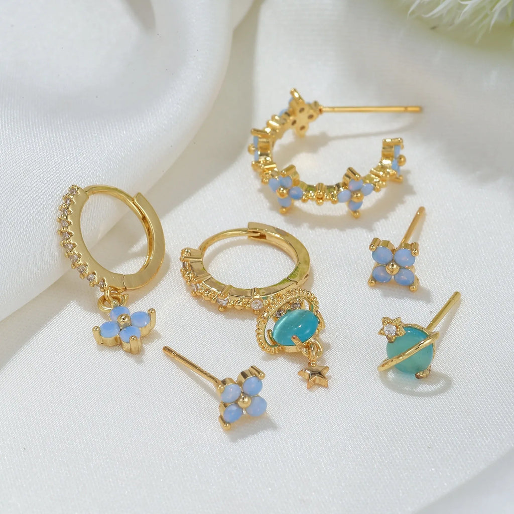 Gold and silver flower stud earrings with blue protein flower nail and zircon mosaic design.