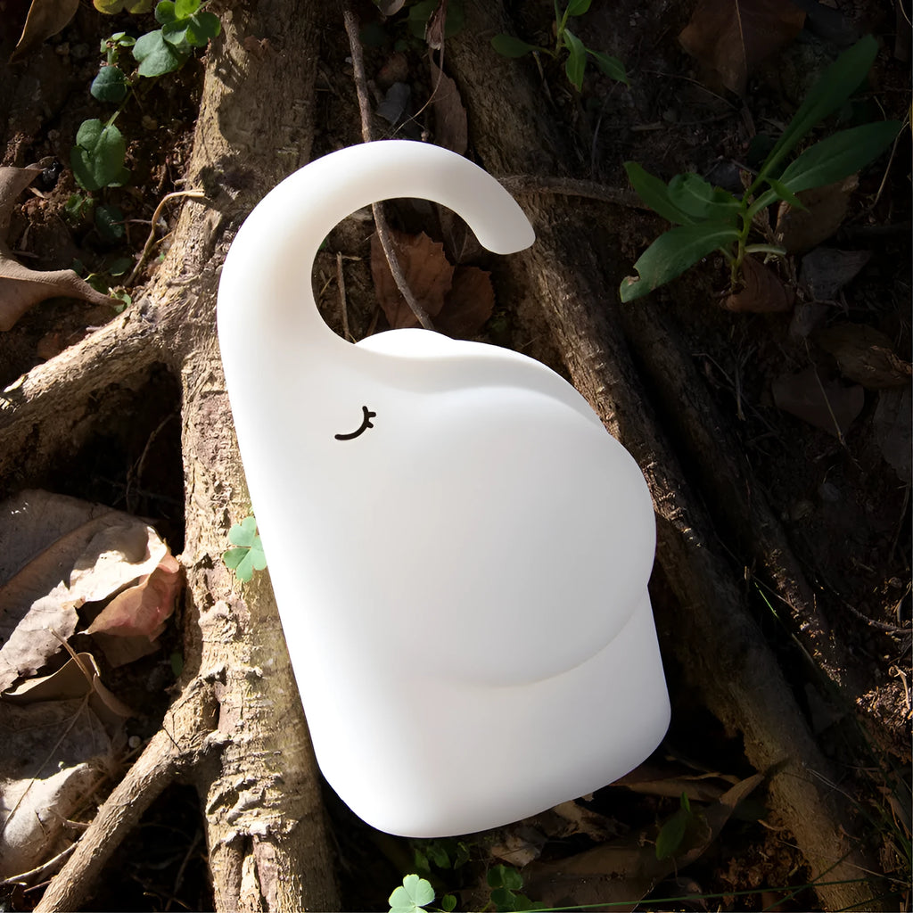 White DOMI elephant-shaped cordless silicone night light on a surface.