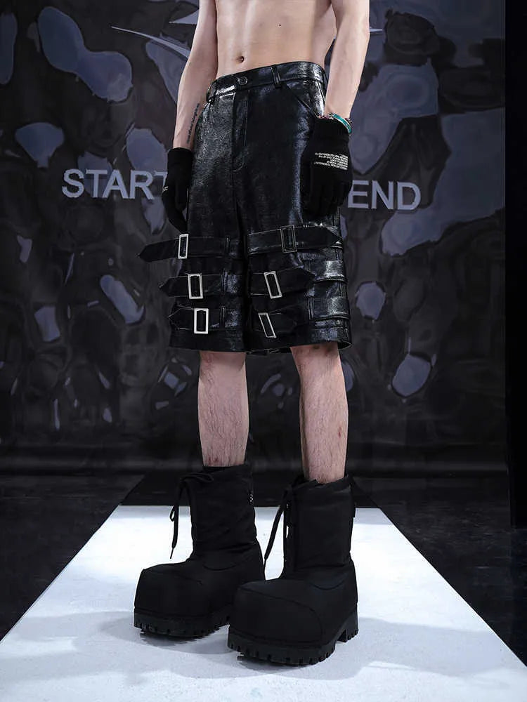 Men's black PU leather casual cropped pants with leather ring details showing medium to low waist construction