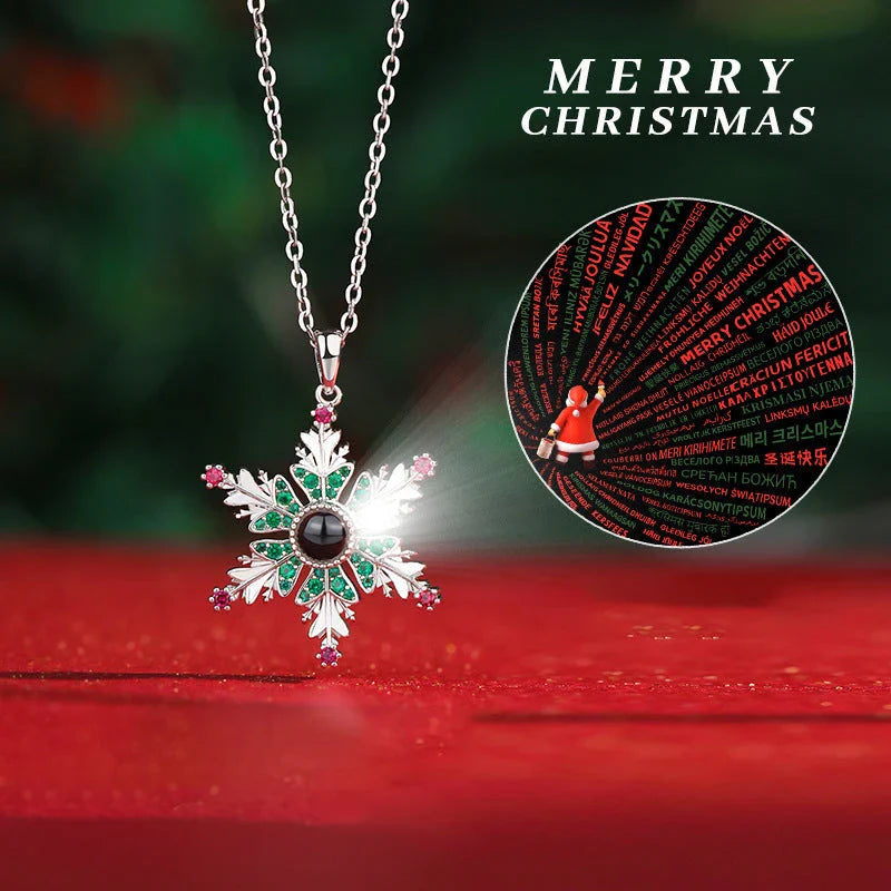 Shimmering snowflake necklace with projection of festive colors or Christmas languages