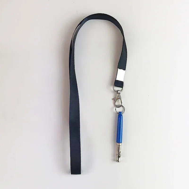 Copper ultrasonic dog training whistle with keychain ring and folding cord on white background