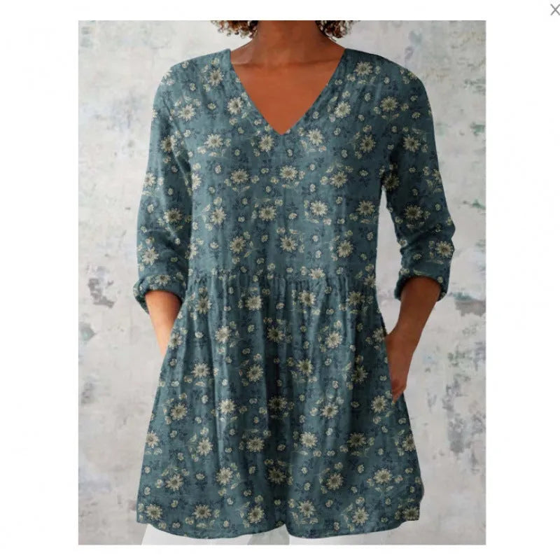 Women's printed loose-fit maxi dress with wide waist and three-quarter length sleeves.