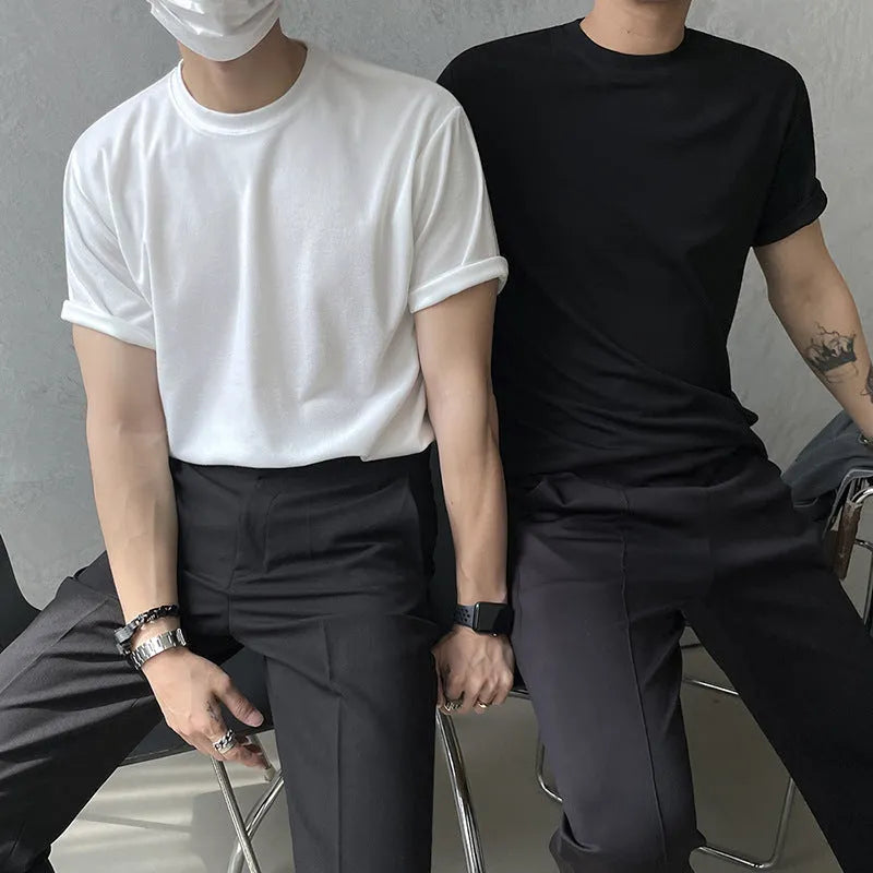 Men's slim fit cotton t-shirt in white or black with round neck and half sleeves on a model