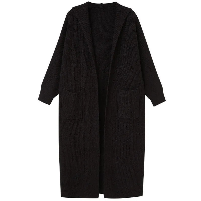 Long grey knitted hooded trench coat on a hanger, showing cardigan front and loose fit.