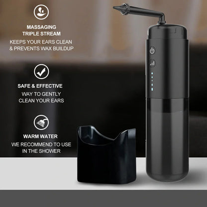 Black silicone ear washer with three nozzles and USB cable on white background