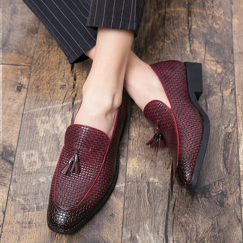 Men's black pointed slip-on shoes with tassel detail on a low-top PU upper