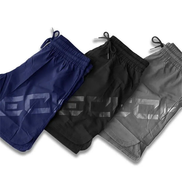 Men's black elastic nylon quick-dry running shorts on a mid-waist, knee-length model.