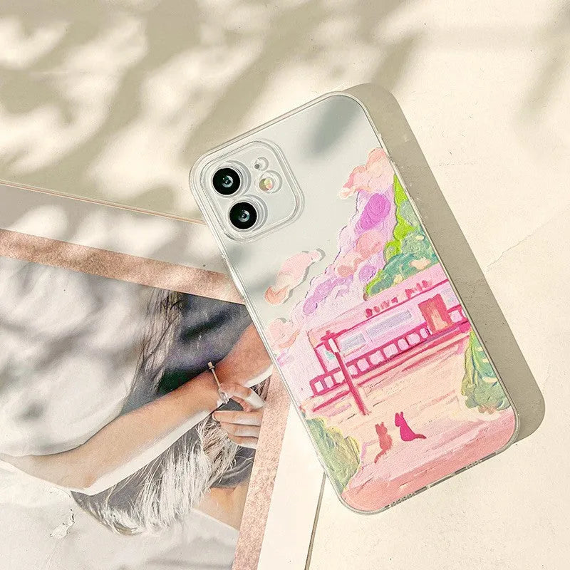 Colourful soft silicone iPhone case with a printed cartoon design of two cats.