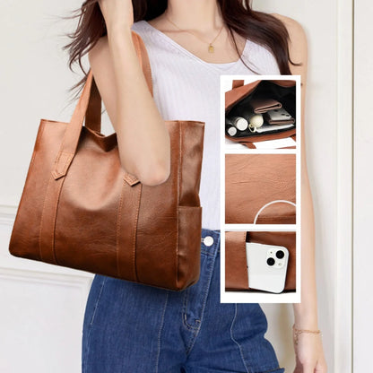 Large capacity commuter tote bag in brown and black with double shoulder straps and mobile phone pocket
