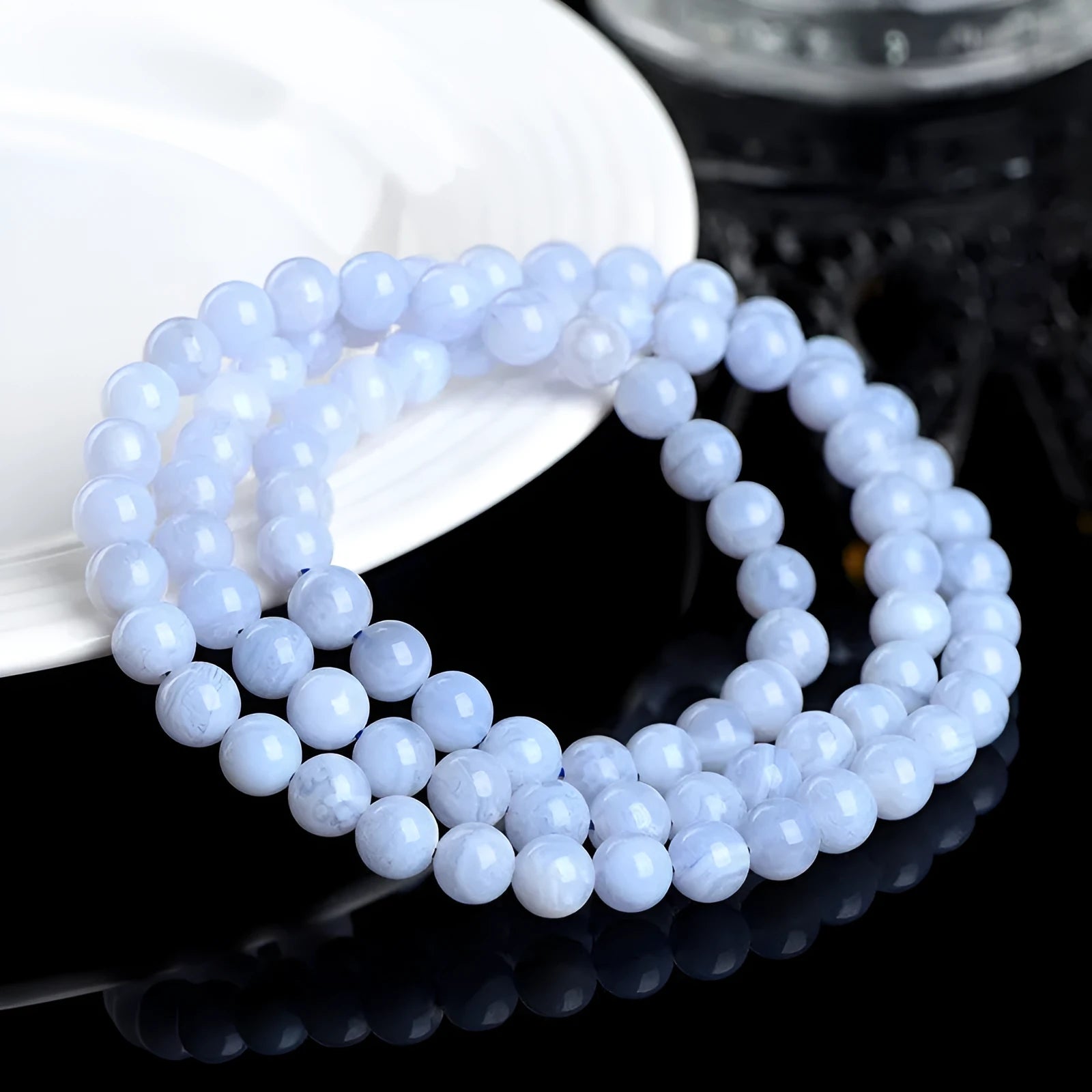 Original unisex blue agate beaded bracelet with natural striped patterns and ruyi elements.