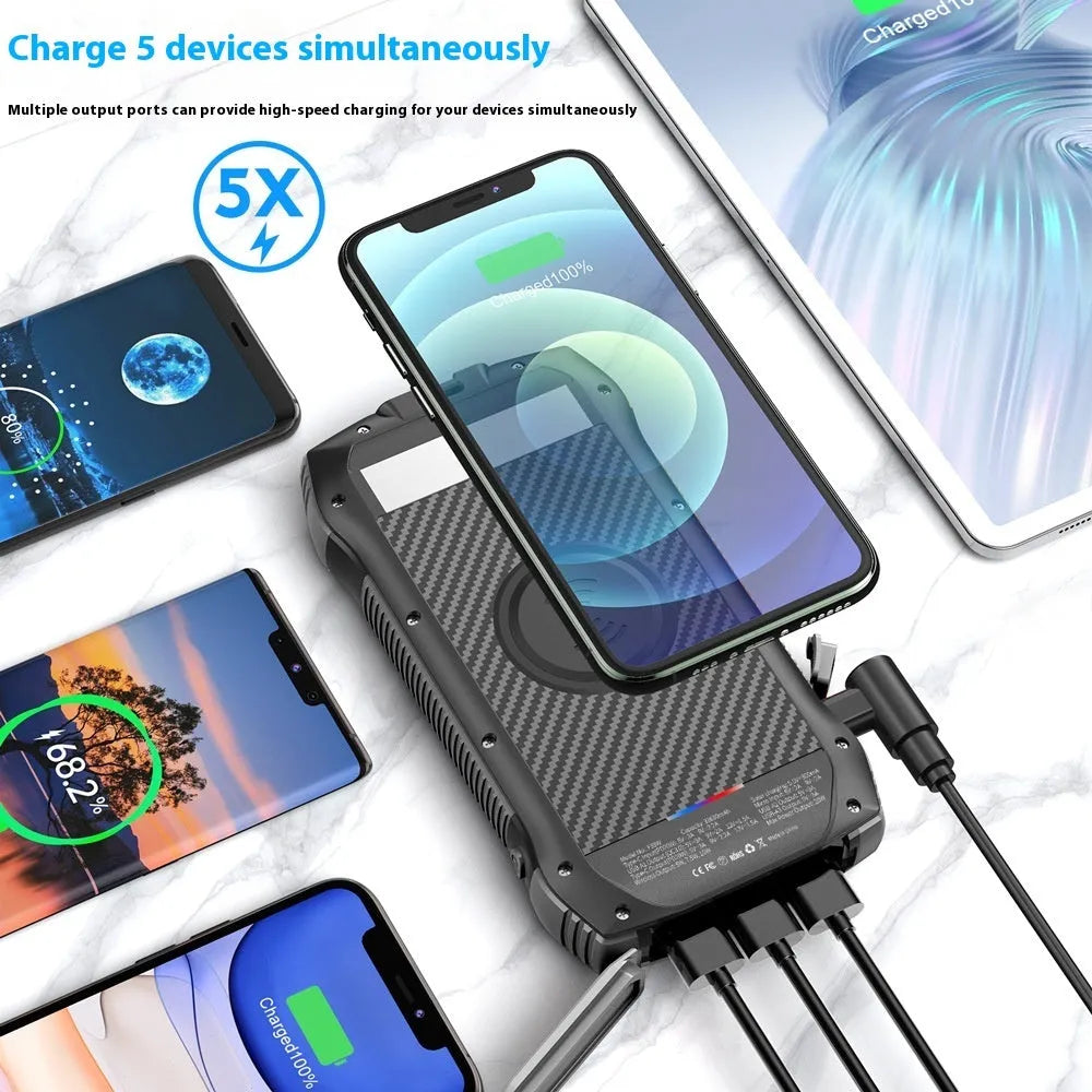 Portable 33500mAh solar power bank with waterproof plastic shell and LED light in black and orange colour