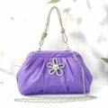 Soft polyester women's dinner messenger bag in shell shape with diamond pattern, shown in lavender purple.
