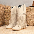 Beige women's western cowboy boots with mid heel, side zipper, and tassel details on a white background