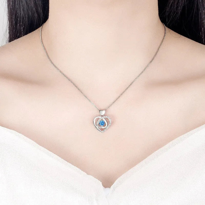 Blue diamond electroplated heart pendant necklace and matching bracelet set on a copper chain.