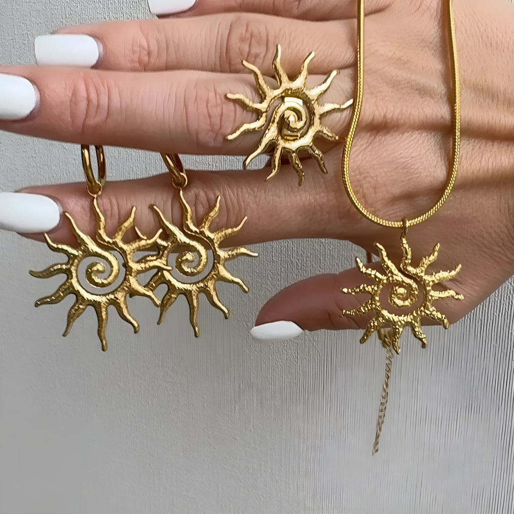 Gold sun hollow pendant necklace and earrings set with electroplated finish on zinc alloy