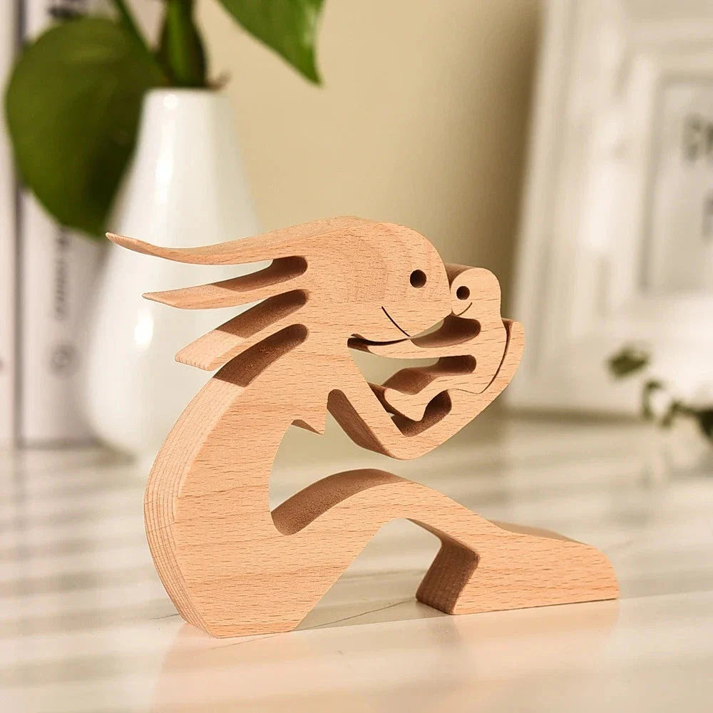 Handcrafted wooden dog sculpture featuring a man and his loyal canine companion