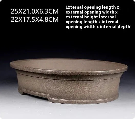 Handmade antique oval purple sand clay bonsai pot showing shallow 25cm length and 21cm width.