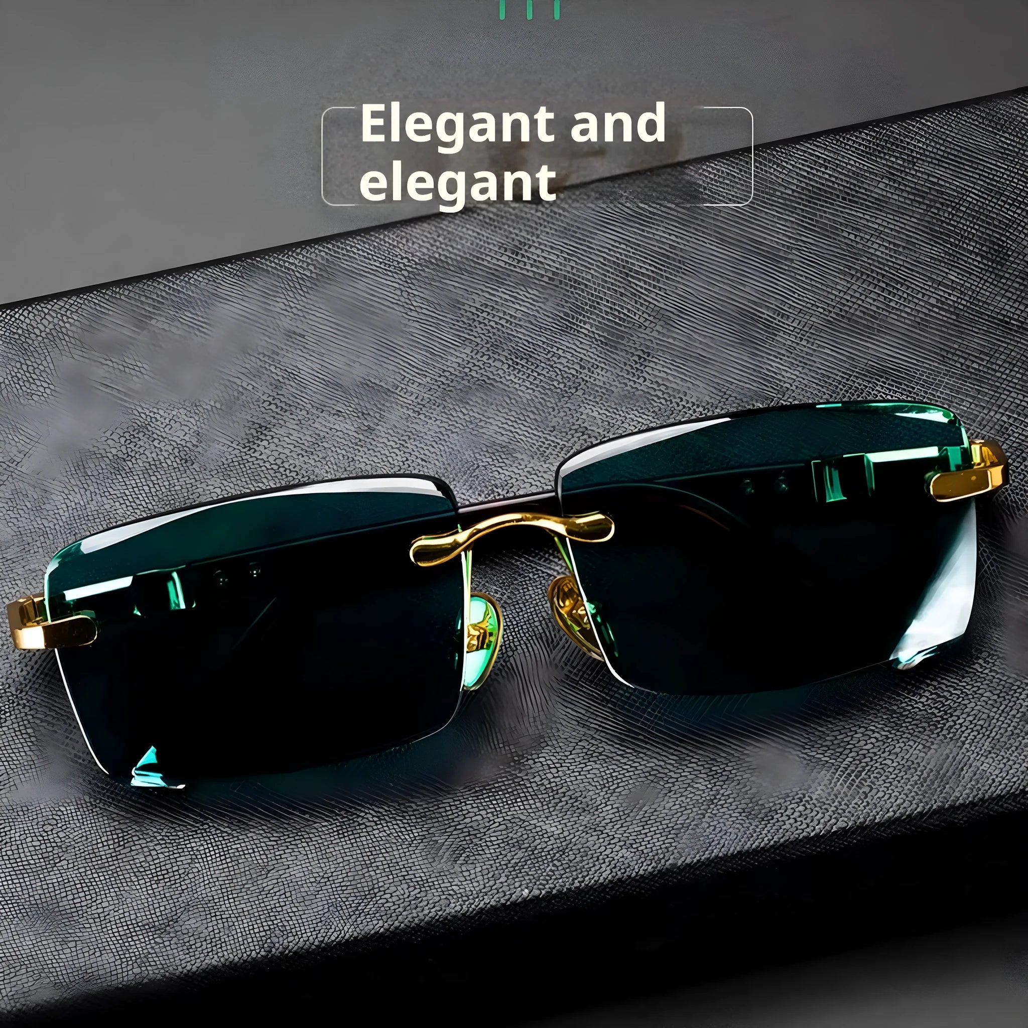 Dark green crystal frameless sunglasses with a case and cleaning cloth on a table.