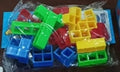 Plastic balancing stacking game with 16 colourful blocks and chassis for family entertainment