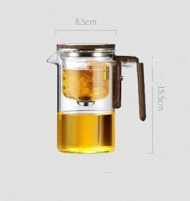 Elegant glass teapot with magnetic separation technology, wooden handle, and drip-free spout for a consistently smooth and flavorful cup of tea