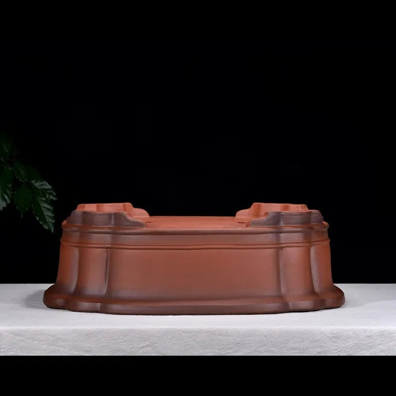Large antique finish purple clay flowerpot with carved tree stump design featuring pine, cypress, pomegranate, golden marble and crabapple motifs