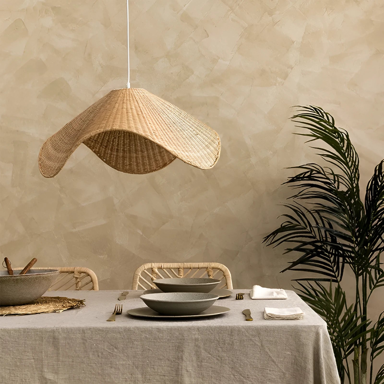 Handmade bamboo and straw rattan chandelier with warm LED light in natural woven design