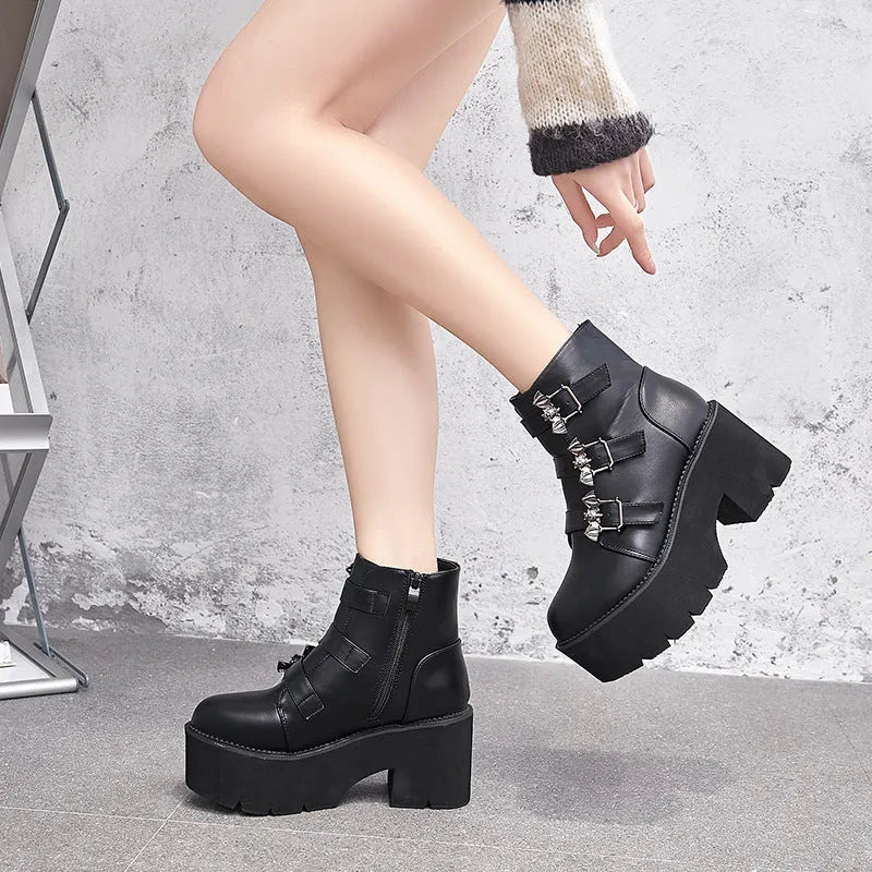 Black women's Harajuku-style punk ankle boots with bat buckle and chunky platform heel.