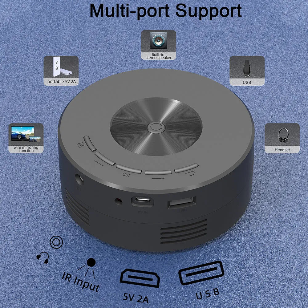 Black mini portable projector for children with phone connectivity on a table.