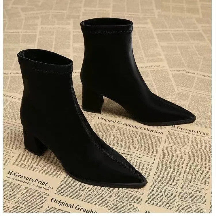 Women's khaki pointed-toe ankle boots with a wedge heel on a rubber sole.