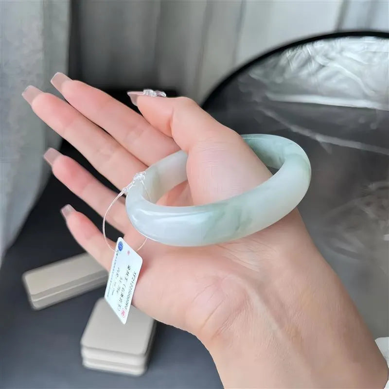 Tian Shan Cui ice-like crystal bracelet with floating flower design and zodiac animal modelling