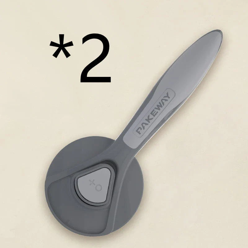 Ergonomic pet grooming brush in mint green, cherry blossom powder, and gentleman grey