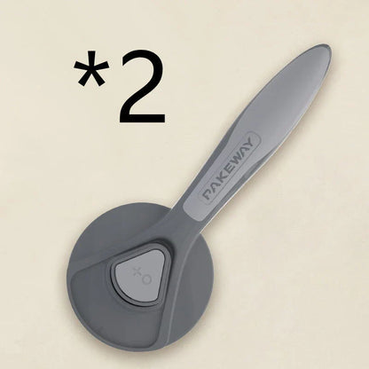 Ergonomic pet grooming brush in mint green, cherry blossom powder, and gentleman grey