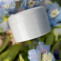 Plastic spiral stem bracket flower arrangement tool in green, with spiral design for holding stems in a vase
