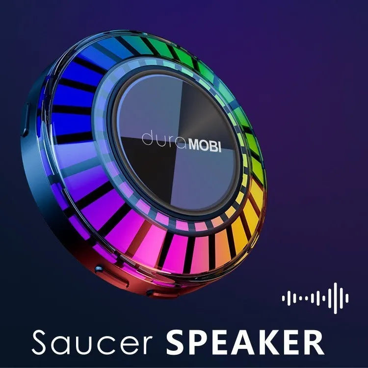 Black portable wireless Bluetooth subwoofer with 72-colour breathing rhythm lighting on a desktop