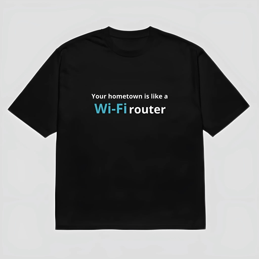 Man wearing a black loose-fit t-shirt with a large 3D digital printed cartoon design on the front.