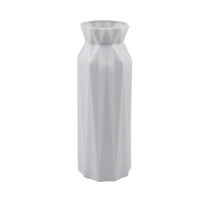 A sturdy green melamine vase with a wide 7.2cm base on a wooden surface.