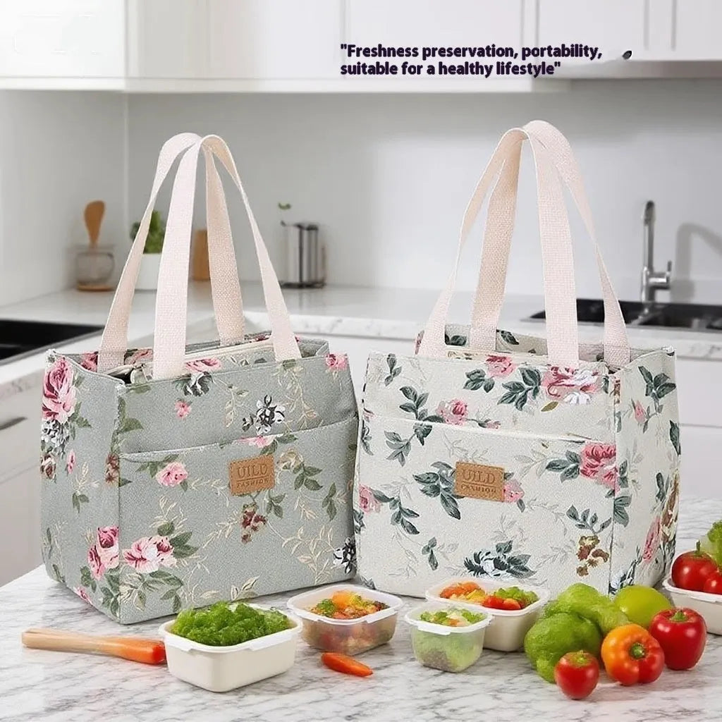 Women's printed canvas tote bag with aluminium hardware in a choice of floral and cat designs.