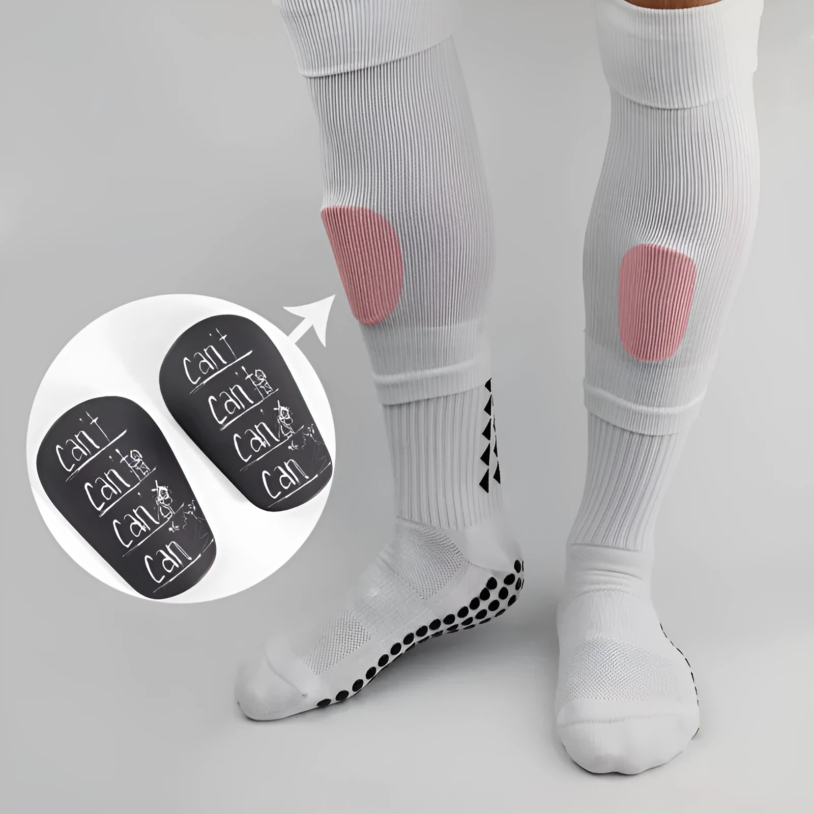A pair of white PU football shin guards for adult training, showing the strap and protective shell.