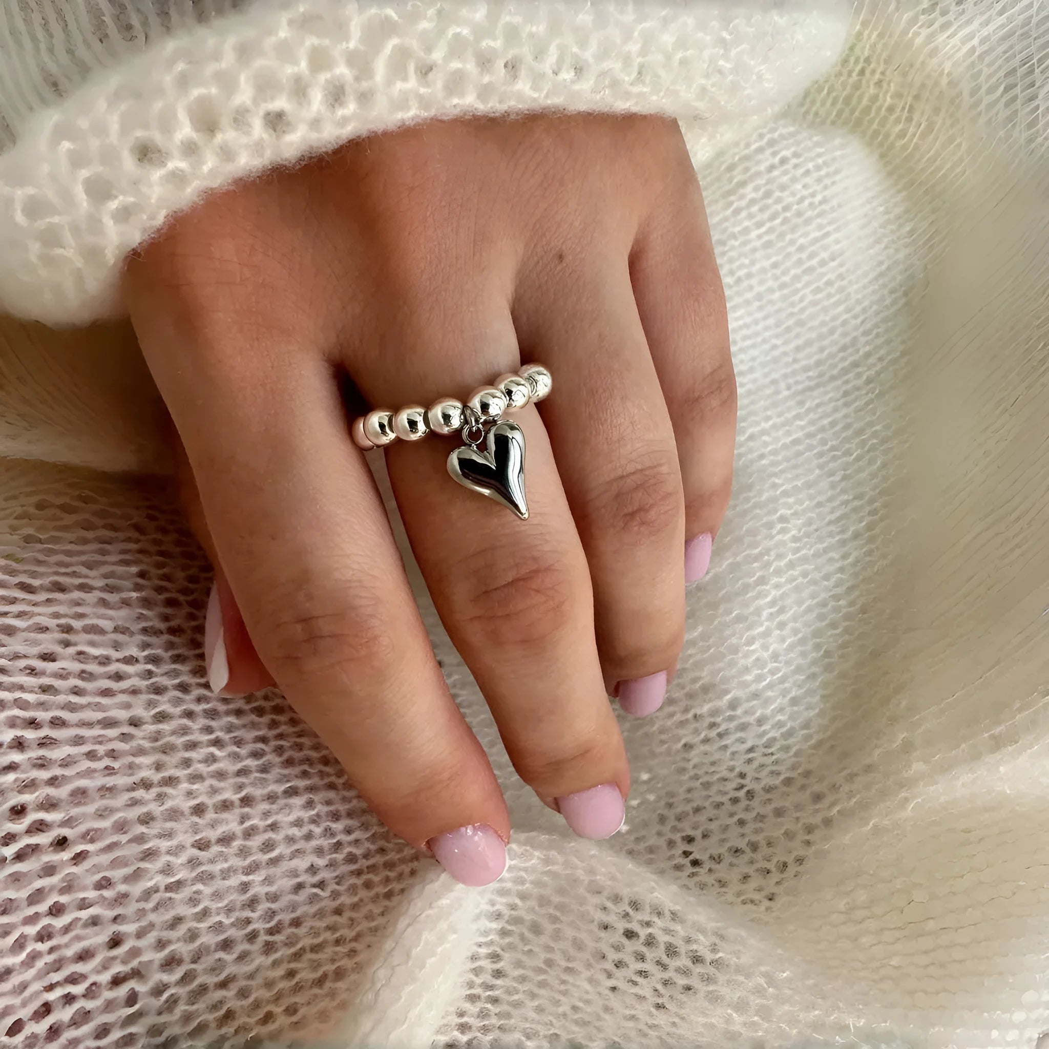 Handmade beaded elastic ring with geometric heart design in gold or silver electroplated finish