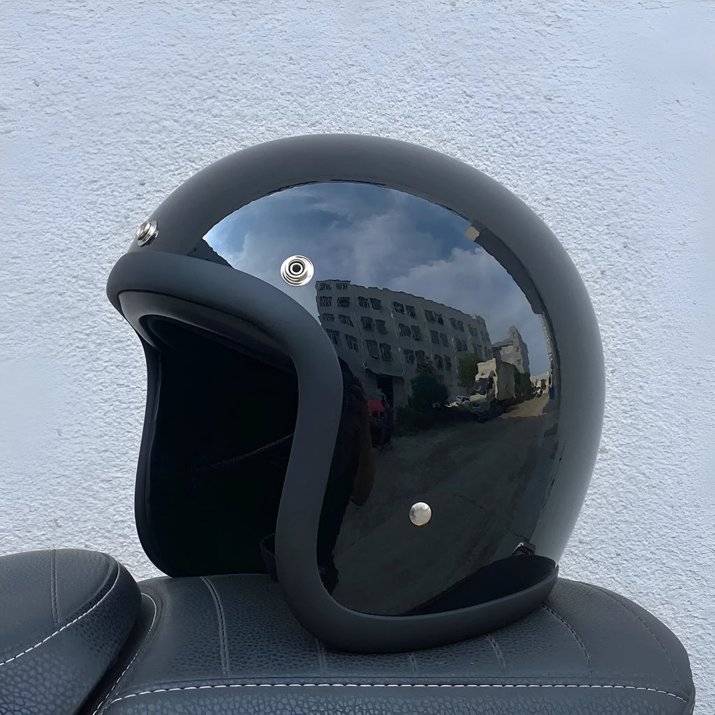 Glass fibre FRP retro half motorcycle helmet shown in a cement grey colour.
