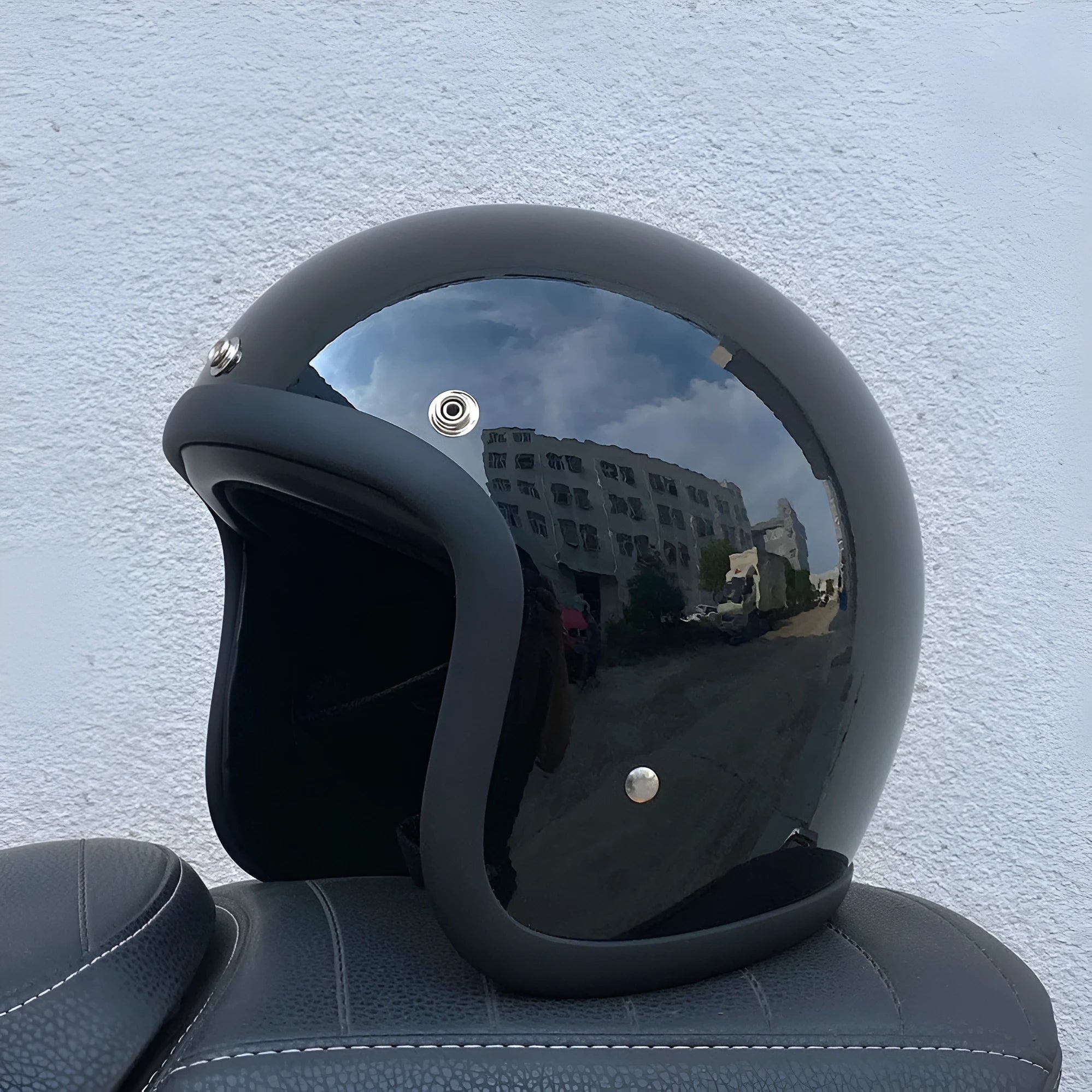 Glass fibre FRP retro half motorcycle helmet shown in a cement grey colour.
