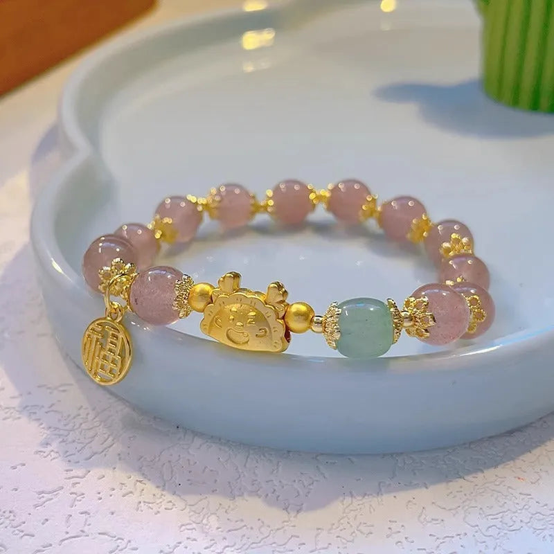 Women's floral glazed bracelet with electroplated glass beads in red, pink, and white pearl colours featuring zodiac animal modelling.