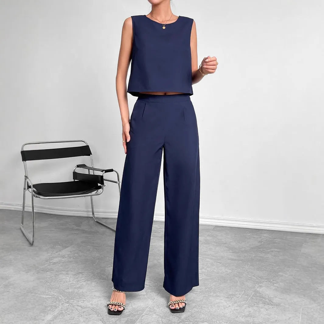 Red polyester two-piece set showing sleeveless top and wide leg trousers on Asian size mannequin