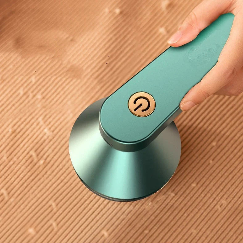 Green and white USB-powered fabric shaver device for removing pilling from clothing