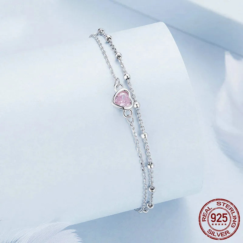 Women's sweet style sterling silver 925 bracelet with small heart-shaped charm on an adjustable chain.