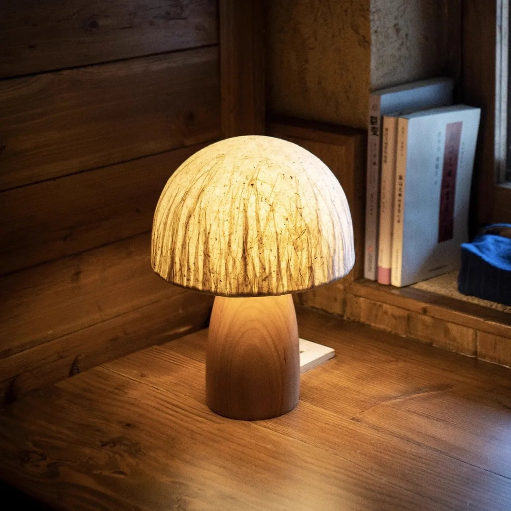 Handmade black walnut mushroom lamp with Japanese style ambient glow on tabletop
