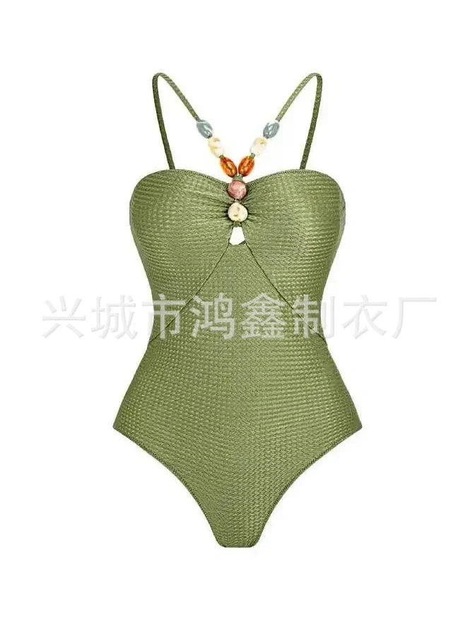 Women's one-piece swimsuit with hollow gem sling design in sapphire blue colour