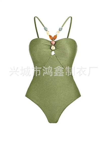 Women's one-piece swimsuit with hollow gem sling design in sapphire blue colour