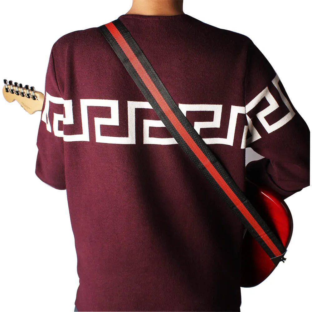 Universal woven crossbody instrument strap for guitar, bass, and ukulele in five colour options.