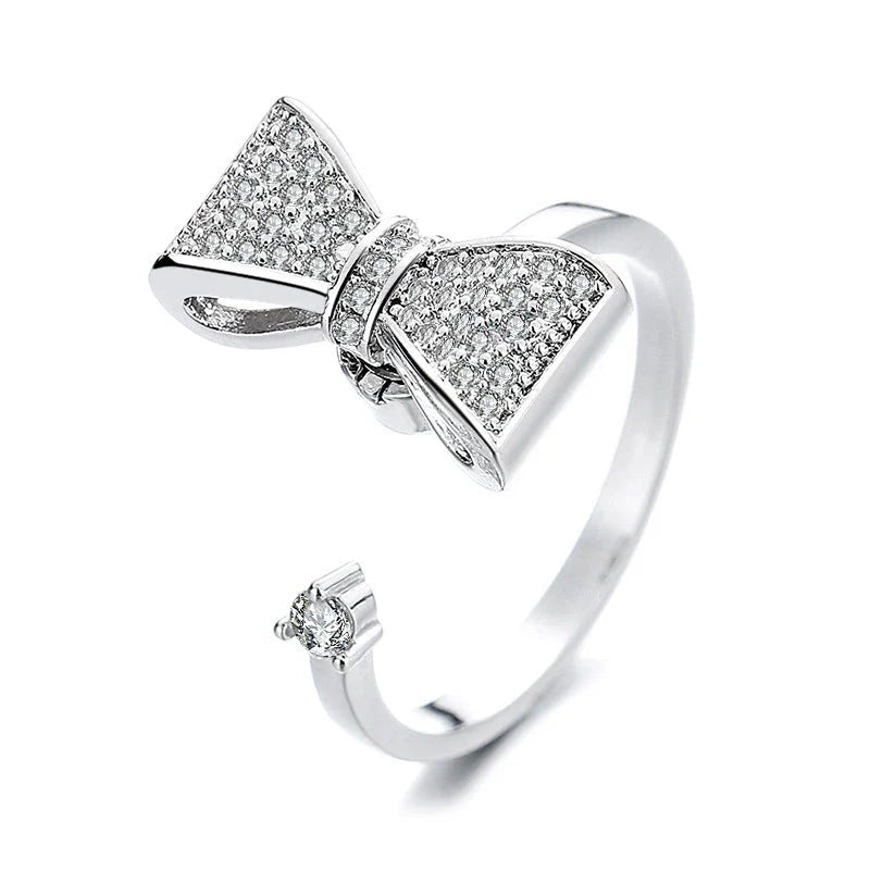 Adjustable rotating spinner ring with elegant flower and bee design in various color options